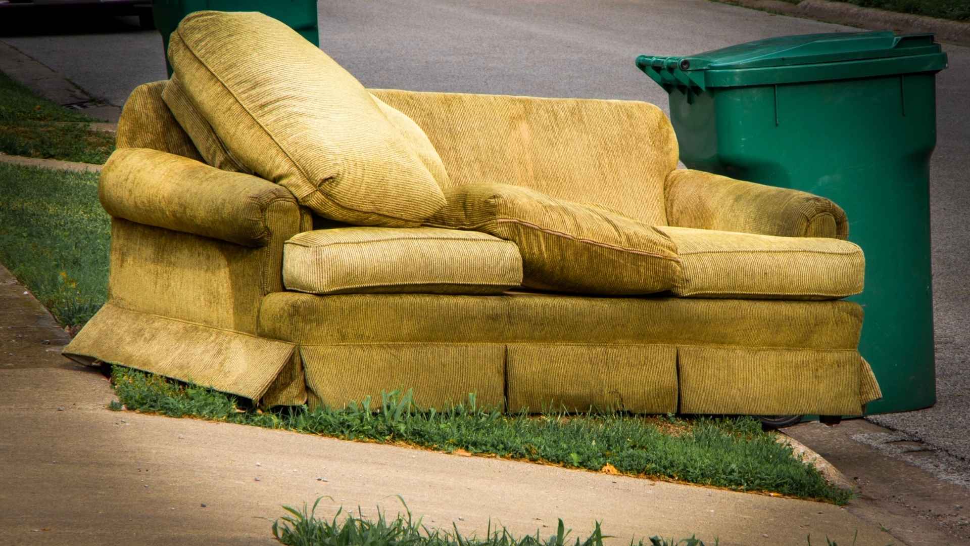 Residential junk, or rather, a sofa, left on the sidewalk.
